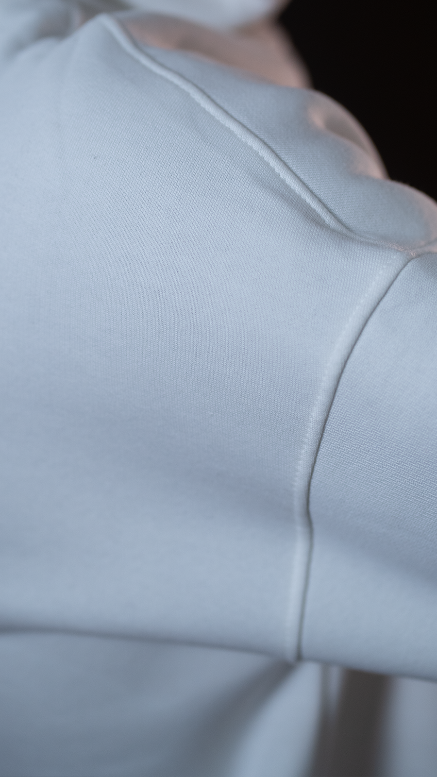 Close-up of a White Hoodie For Men fabric texture